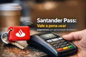 Terminal de pagamento com chaveiro Santander e mão prestes a pagar